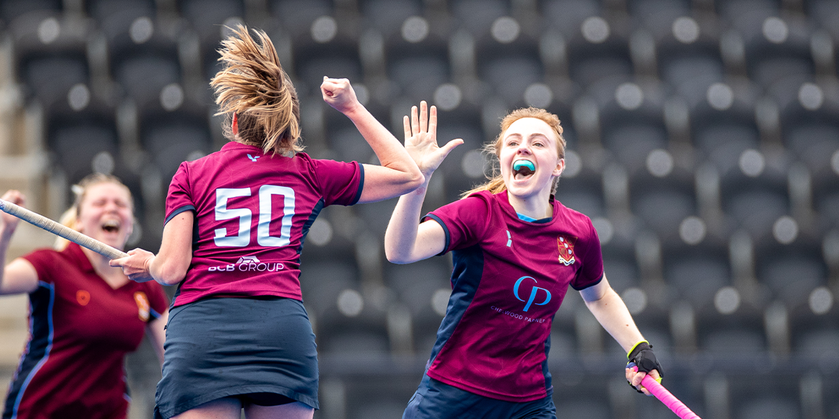 female players high fiving
